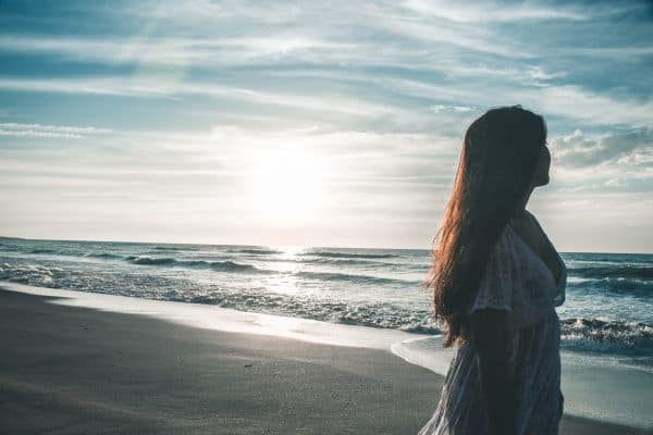 Woman walking on the beach